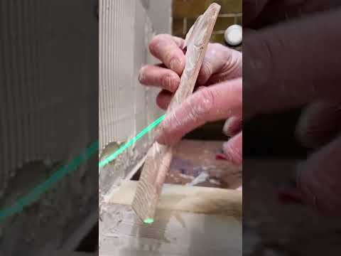 Overcoming an uneven shower wall with tile